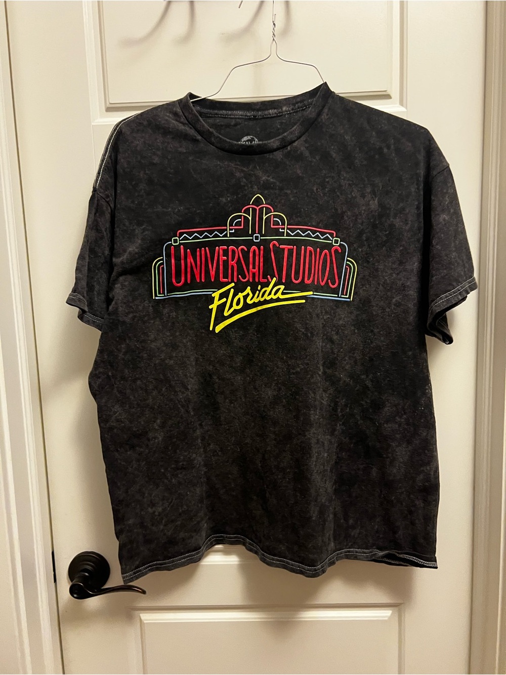 Universal Black Short Sleeve Vintage-Look Graphic Tee with Red and Yellow Logo
